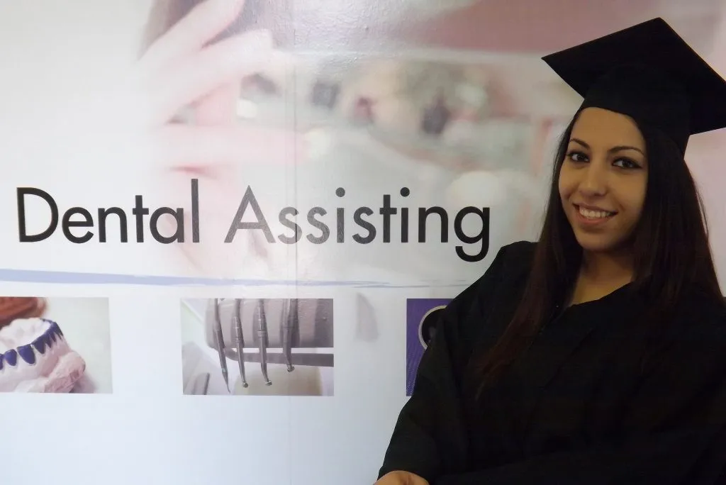 ASDA graduates in cap and gown